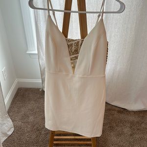 White with band and gold sequence, fitted dress.